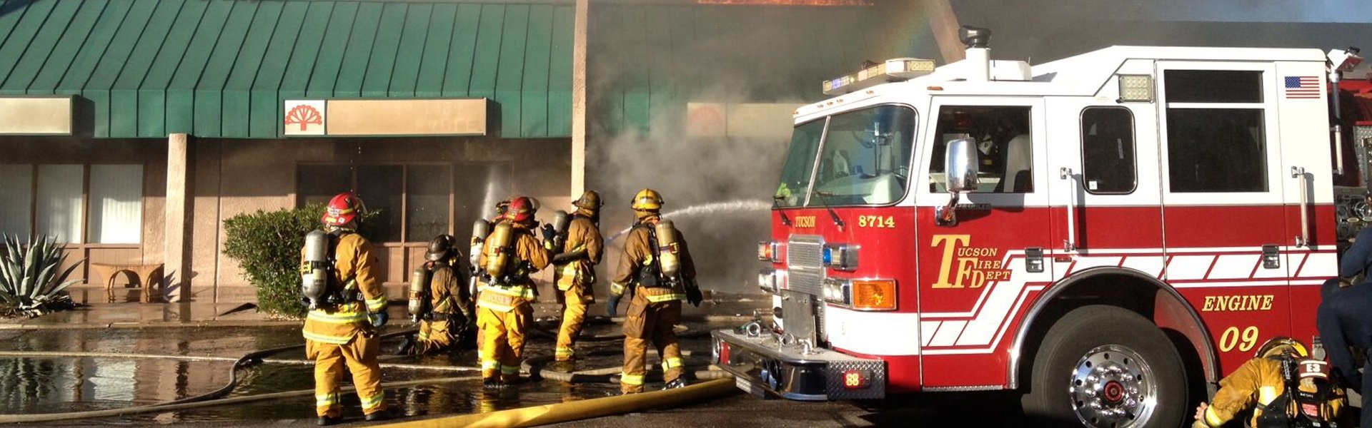 firefighters fighting strip mall blaze